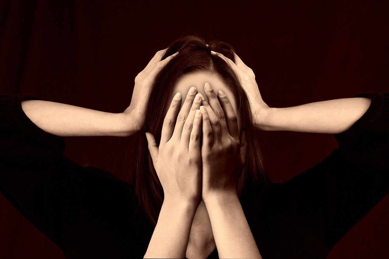 Woman with a concerned expression, suggesting emotional struggle